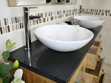 Stunning Bathrooms and More Black Quartz Top and White Marble Basins